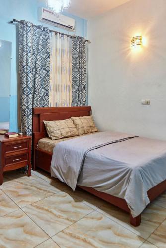 Ένα ή περισσότερα κρεβάτια σε δωμάτιο στο MH - Ground Floor Apart