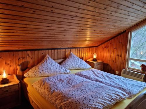 Postel nebo postele na pokoji v ubytování Ferienhaus Martina