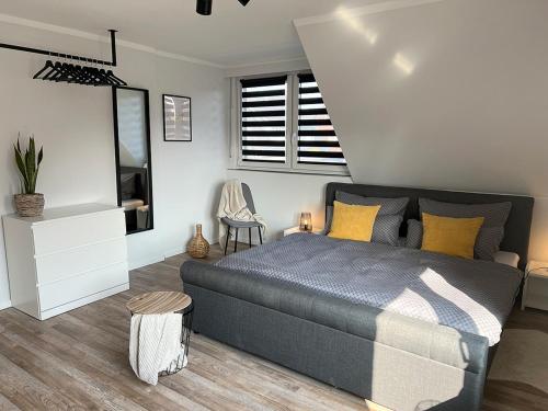 a bedroom with a bed and a television in it at Ferienwohnung Becker in Südlohn