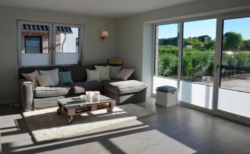 a living room with a couch and a coffee table at Småland in Kronsgaard