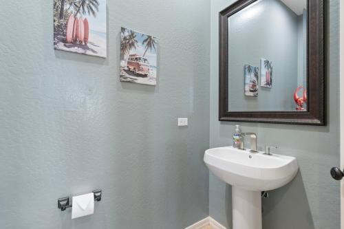 a bathroom with a sink and a mirror at Stunning 4br Retreat W Private Pool in Phoenix