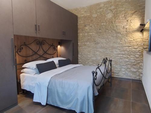 Ένα ή περισσότερα κρεβάτια σε δωμάτιο στο Borgo Ragnitill