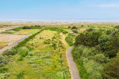 an aerial view of a field with a road at Breakwater Resort in Grayland