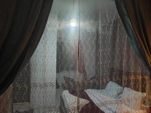 a view of a window with rain on it at ALShawarbi Plaza Hotel in Cairo