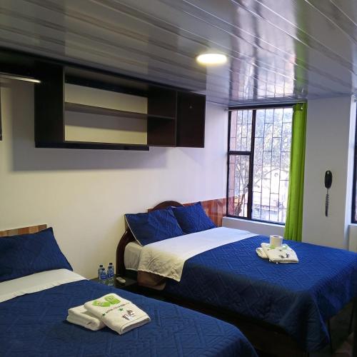 Postel nebo postele na pokoji v ubytování Hotel Villa Real