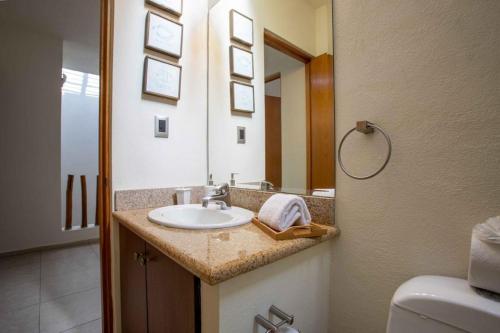 a bathroom with a sink and a mirror at Villa en Nuevo Vallarta 15 in Nuevo Vallarta 