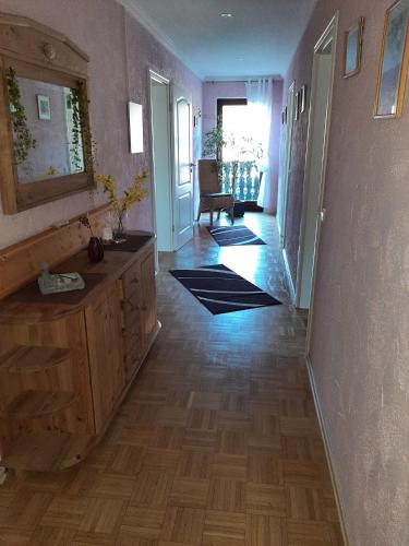 a hallway of a home with a wooden floor at Ferienwohnung Bergblick in Hallenberg