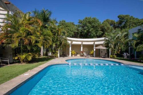 a swimming pool in front of a house at Villa en Nuevo Vallarta 15 in Nuevo Vallarta