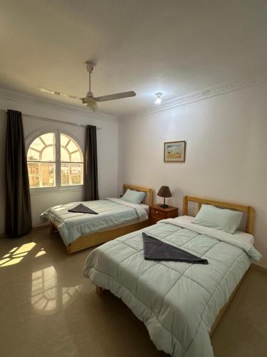 Postel nebo postele na pokoji v ubytování Harmony House Luxor