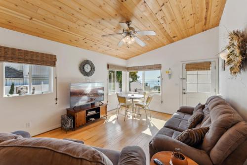 a living room with a couch and a table at Summerland Double Dolphin in Santa Barbara