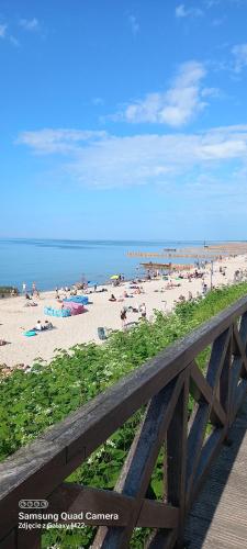 a view of a beach with people on it at ARKA 2 domki na wodzie w Mielnie 400 metrów do morza, rower wodny, Wifi, Parking in Mielno