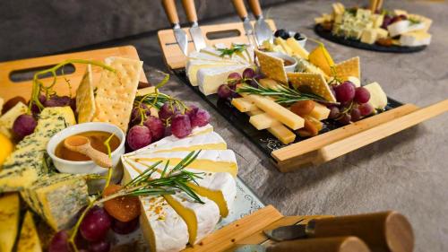 a table with a bunch of different types of food at Hotel Bucura in Călimăneşti