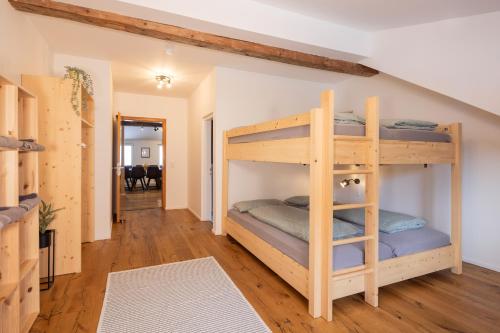 a bunk bed room with two bunk beds at Schöne FeWo im Allgäu für bis zu 10 Pers. in Bad Hindelang