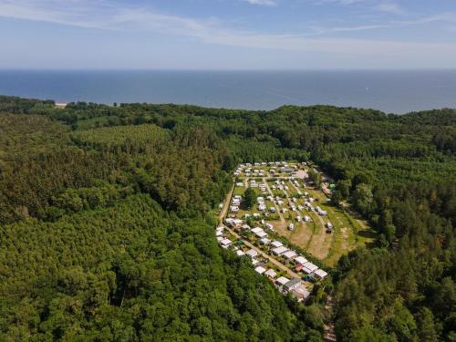 an aerial view of a campground in the middle of a forest at Tinyhouse 2 in Heringsdorf