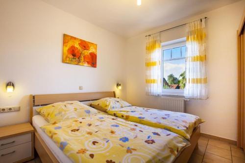 Postel nebo postele na pokoji v ubytování Haus Südblick, Nr 2