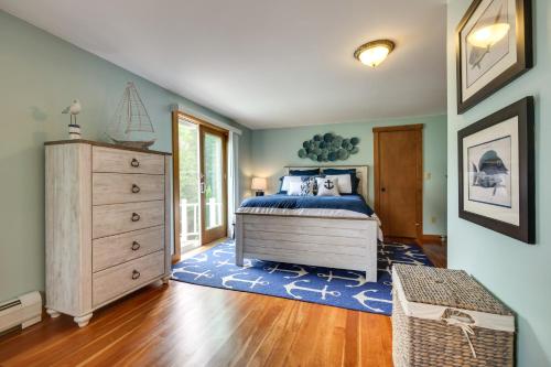 a bedroom with a bed and a dresser at Enchanting Waterfront Sorrento Home with Deck! in Sorrento