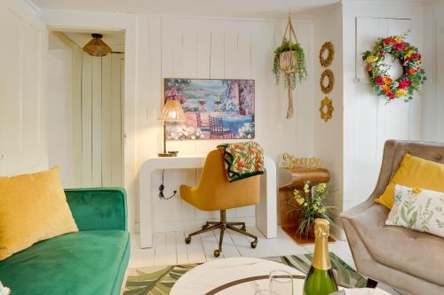 a living room with a couch and a chair at Walk to Eats Mtn-View Hammondsport Hideaway! in Hammondsport