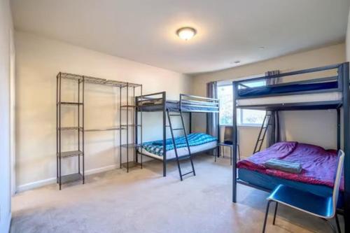 a room with three bunk beds in it at Affordable Dorm Daly City in Daly City