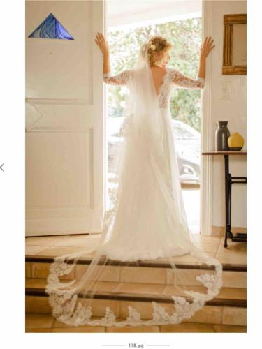 une femme en tenue de mariage debout à la porte dans l'établissement villa near sea, heated pool,Isolella,Corsica, à Pietrosella