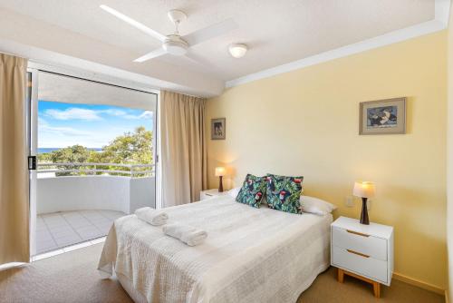 a bedroom with a bed and a balcony at 6- 'Cote D'Azur' 6 Douglas Street Sunshine Beach in Sunshine Beach