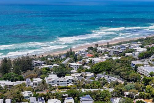 an aerial view of a beach with houses and the ocean at 6- 'Cote D'Azur' 6 Douglas Street Sunshine Beach in Sunshine Beach