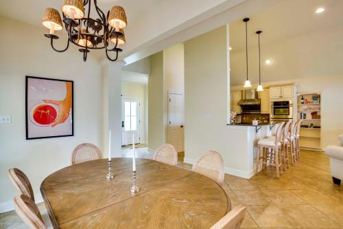 a dining room and kitchen with a table and chairs at Waterfront Home 30 Mi to New Orleans with Boat Dock in Slidell