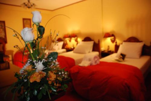 Postel nebo postele na pokoji v ubytování Hotel Casona Colon Inn