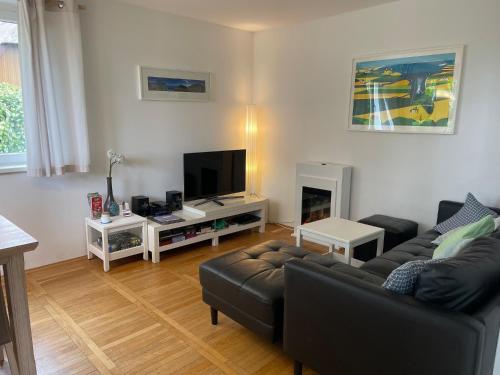 TV a/nebo společenská místnost v ubytování Ferienhaus Boddenblick