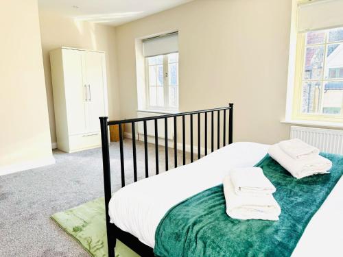 Ένα ή περισσότερα κρεβάτια σε δωμάτιο στο Cozy 3 Bed Thetford Home with WiFi Sleeps 5 Comfortably