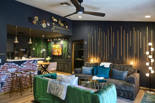 a living room with two couches and a bar at Exquisite jazzy warm deco nearby the Strip - Top 15 Best Vegas Vacation Home recommended by Conde Nast Traveler in Las Vegas