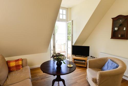 Et tv og/eller underholdning på Ferienwohnung 6 WLAN Sauna Wasserblick