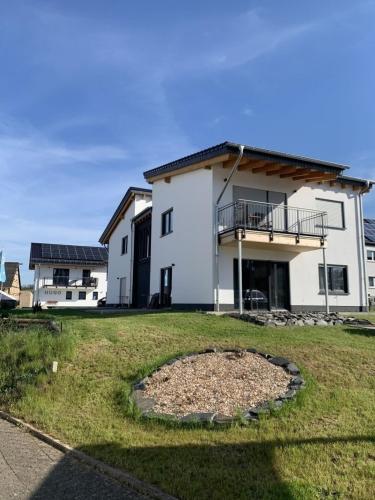 a large white house with a large yard at Zum Rheinblick in Lierschied