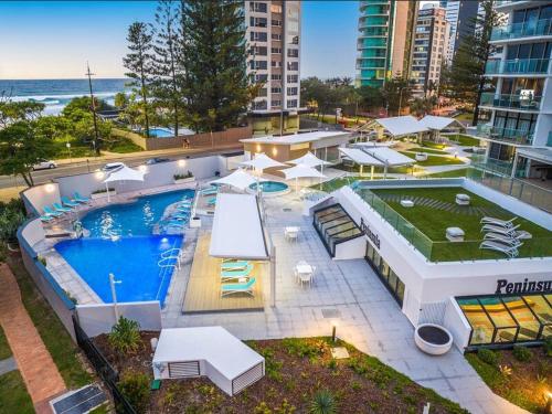an aerial view of a swimming pool in a building at Endless ocean views, spacious, resort facilities in Gold Coast