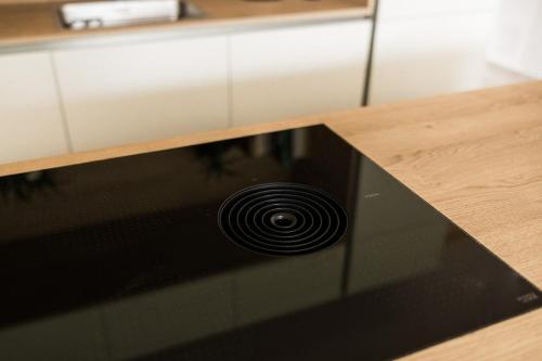 a black stove top oven sitting on top of a counter at Nomad 27 in Bovec