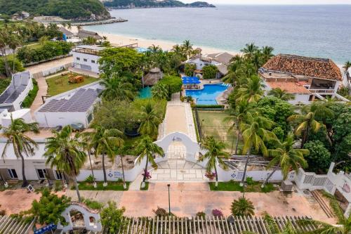 an aerial view of the resort and the beach at Hotel Castillo Huatulco & Beach Club in Santa Cruz Huatulco