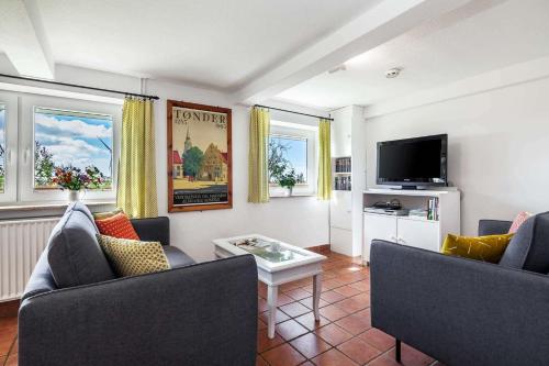 TV a/nebo společenská místnost v ubytování Ferienhaus Reetsommer