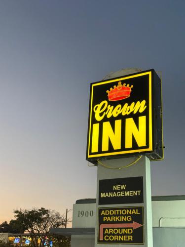 a sign for a crown inn on top of a building at Crown Inn in Fort Lauderdale