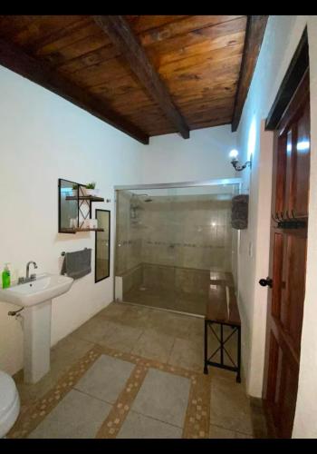 a bathroom with a shower and a sink at Cabañas Tapalpa la laja in Los Espinos