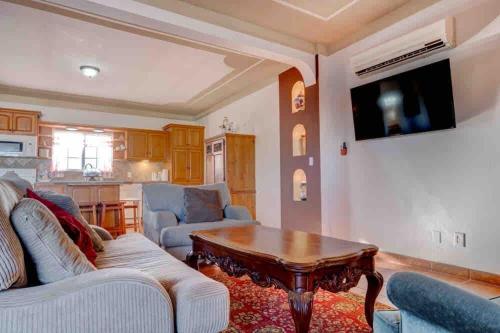 a living room with a couch and a table at CASA DEL MAR-- Sleeps 16, Pool, AC, Wi-Fi, Near Malecón in San Felipe