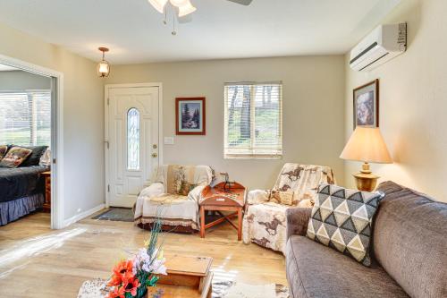 a living room with two couches and a table at Fish, Hike & Relax: Rural Red Bluff Cottage in Red Bluff