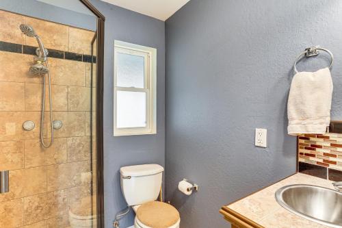 a bathroom with a shower and a toilet and a sink at Fish, Hike & Relax: Rural Red Bluff Cottage in Red Bluff