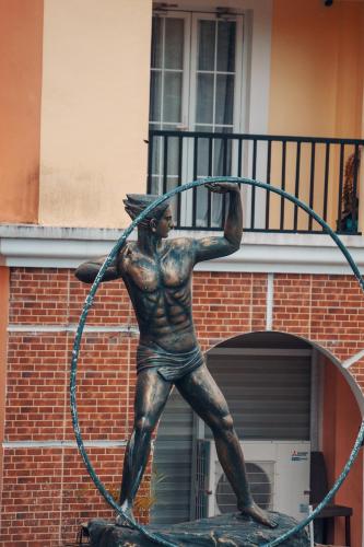 a statue of a man with a hula hoop at Highland Stays at Mines View in Baguio