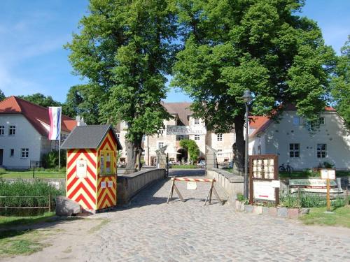 a small house in the middle of a street at Holiday home Usedom Residenz Balmer See Kümpel in Balm