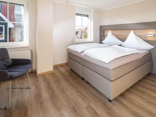 Postel nebo postele na pokoji v ubytování Seemannsgarn Comfortable holiday residence