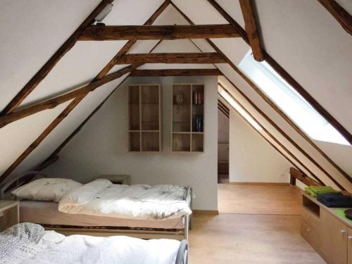 Ένα ή περισσότερα κρεβάτια σε δωμάτιο στο Fireplace room Comfortable holiday residence