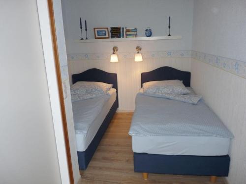 En eller flere senge i et værelse på Friese-Ostseetraum Comfortable holiday residence