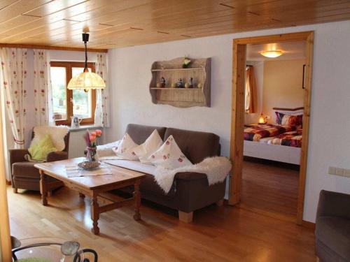 a living room with a couch and a bed at on the Willmann farm in Erlenbach