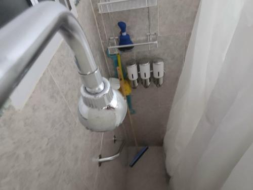 a bathroom with a sink and aaucet at Ty Bach in Puerto Madryn
