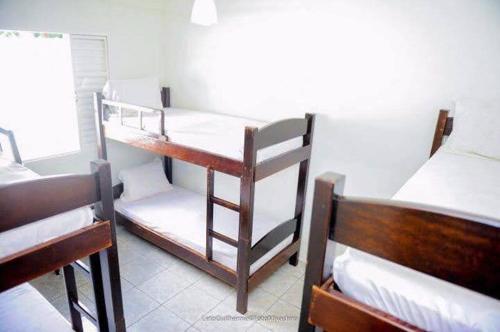 Una cama o camas en una habitación de Chácara Salone