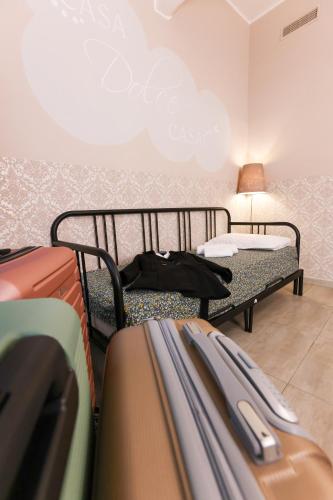 a room with luggage and a bed and a lamp at casa dolce casa in Rome